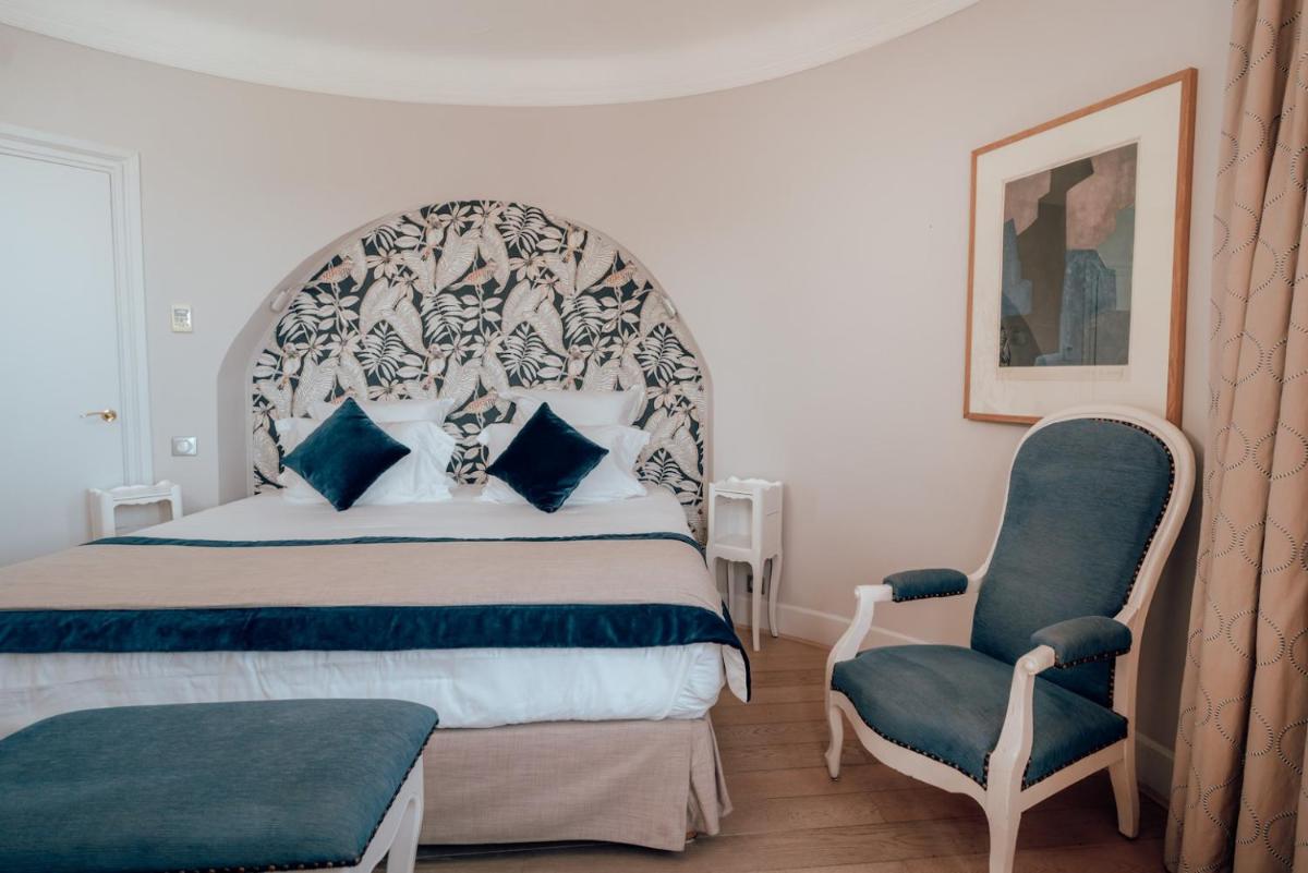 Un ou plusieurs lits dans un hébergement de l'établissement Ermitage de l'Oasis & Spa - Cannes Mandelieu