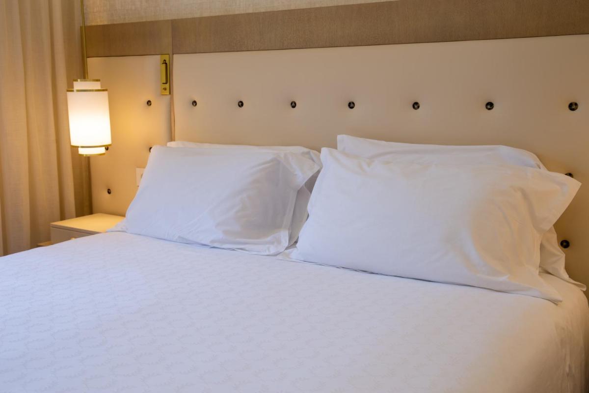 Uma cama ou camas num quarto em Vila Alba Resort
