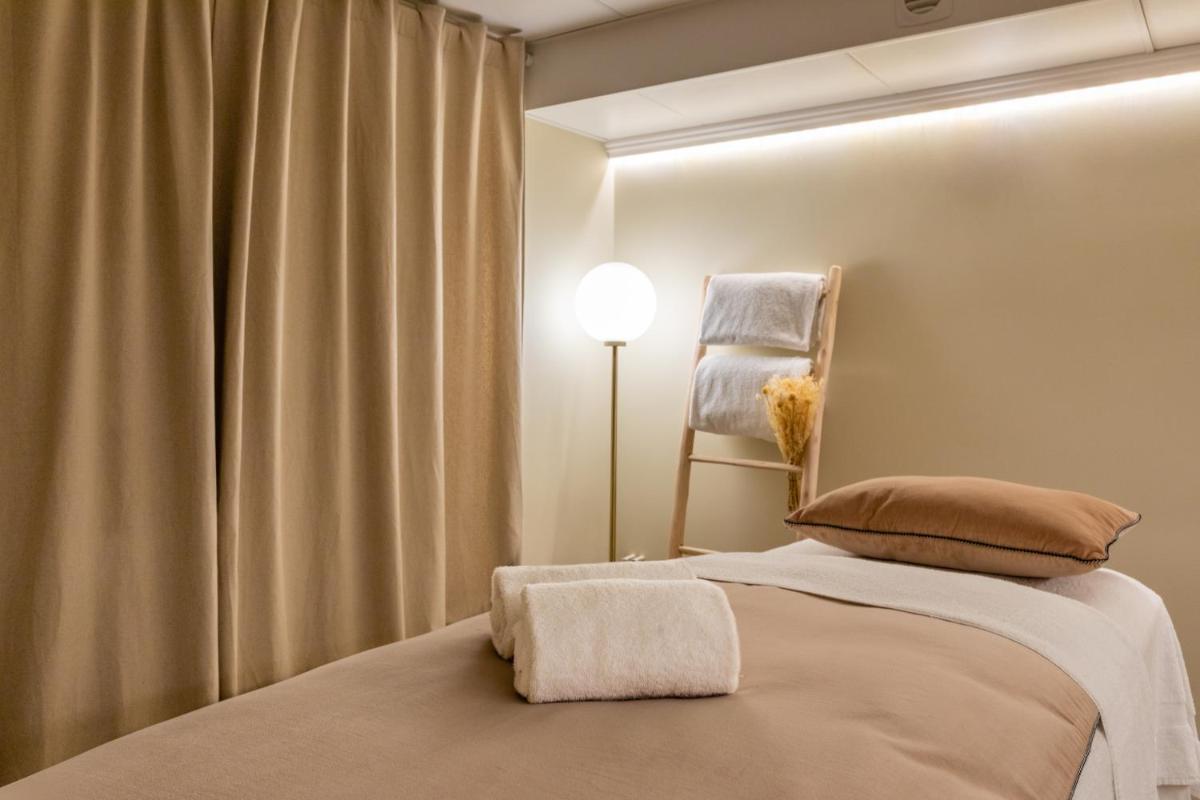 Un ou plusieurs lits dans un hébergement de l'établissement Hotel Residence Europe & Spa