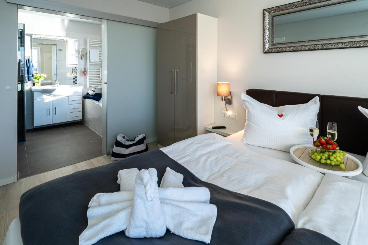 Ein Bett oder Betten in einem Zimmer der Unterkunft Schwimmende Häuser im BALTIC SEA RESORT