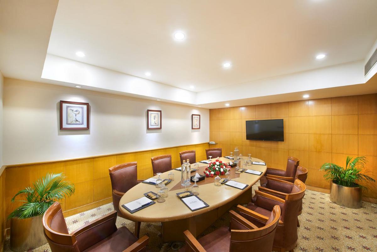 a conference room with a long table and chairs at The Accord Metropolitan in Chennai