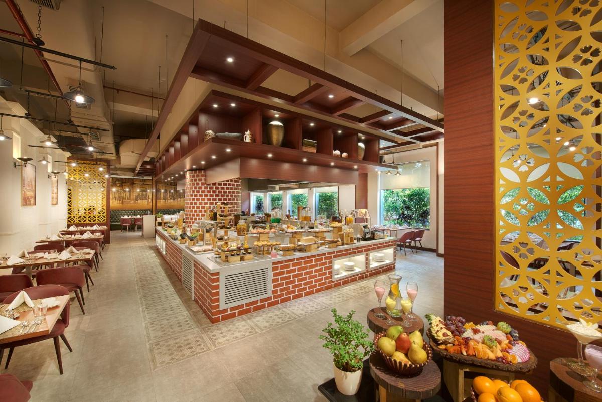 a restaurant with aasteryasteryasteryasteryasteryasteryasteryasteryasteryasteryasteryastery at The Accord Metropolitan in Chennai