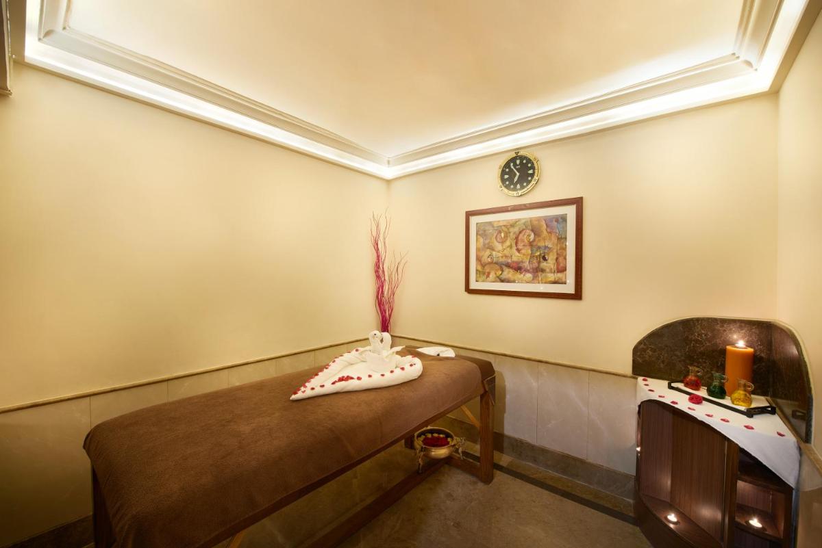 a room with a table with a vase on it at The Accord Metropolitan in Chennai
