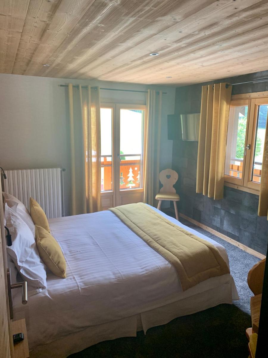 Un ou plusieurs lits dans un hébergement de l'établissement Hameau des Prodains - Hôtel