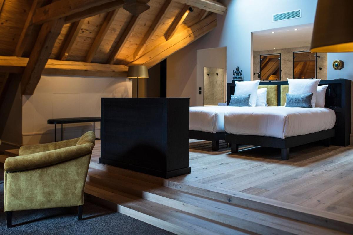 Un ou plusieurs lits dans un hébergement de l'établissement Hôtel L'Incomparable Aix-Les-Bains