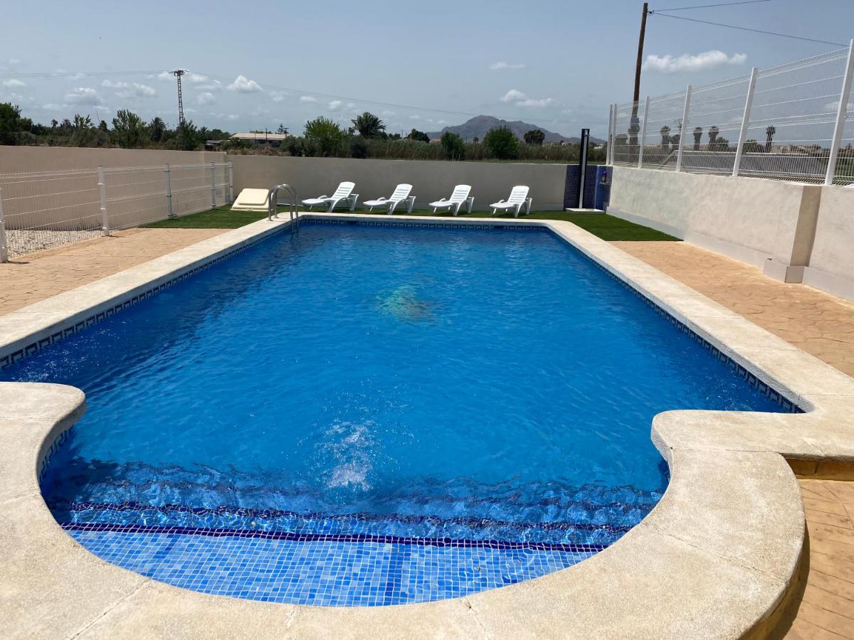Villa Dolores, un chalet con piscina y barbacoa en la huerta del Segura. - Housity