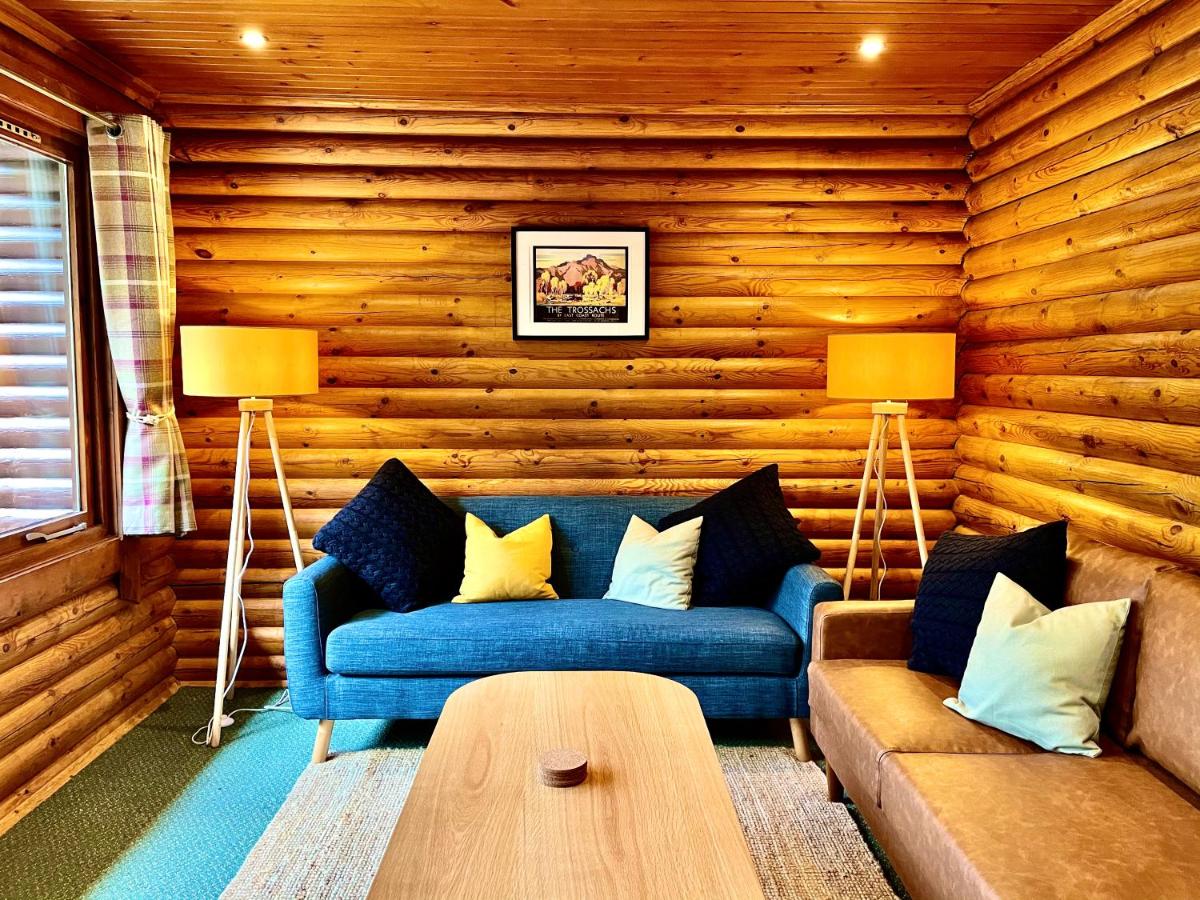 Riverside log cabins - Housity