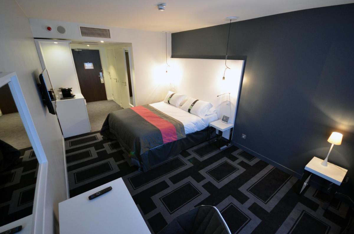 Un ou plusieurs lits dans un hébergement de l'établissement Holiday Inn Dijon Toison D'or by IHG
