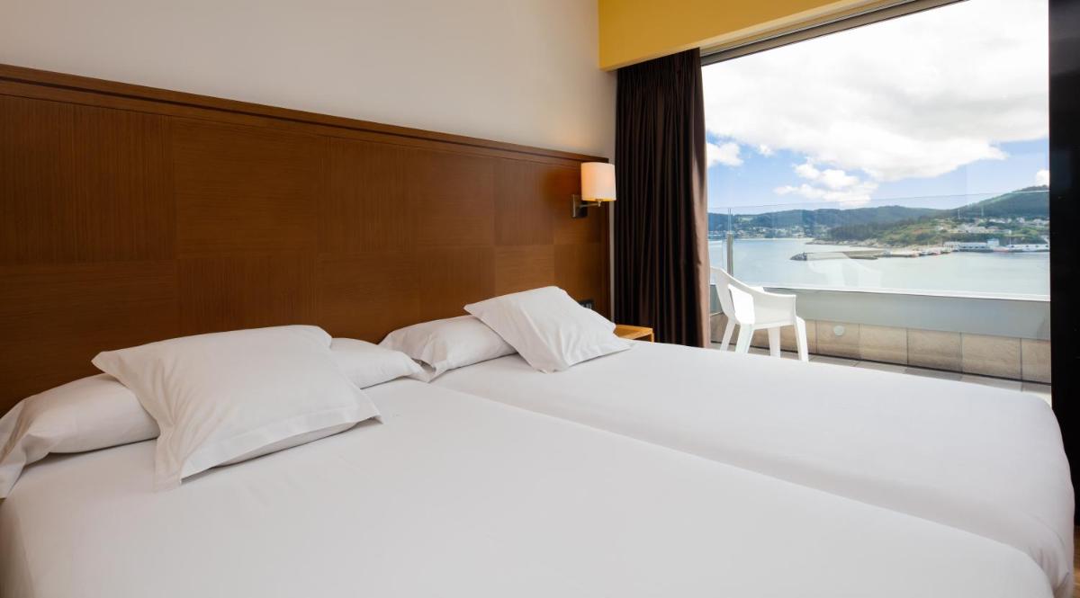 Cama o camas de una habitación en Hotel Thalasso Cantabrico Las Sirenas 4 Superior
