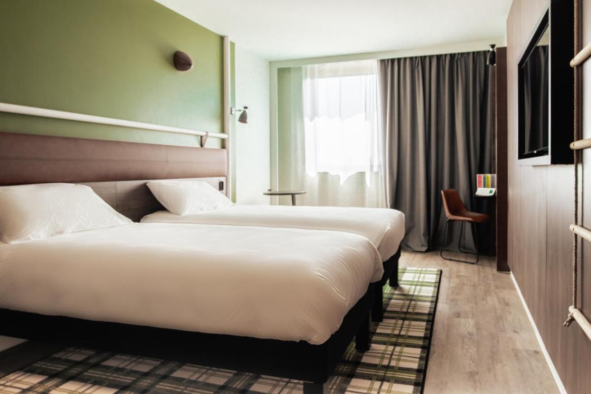 Un ou plusieurs lits dans un hébergement de l'établissement ibis Styles Castelnaudary