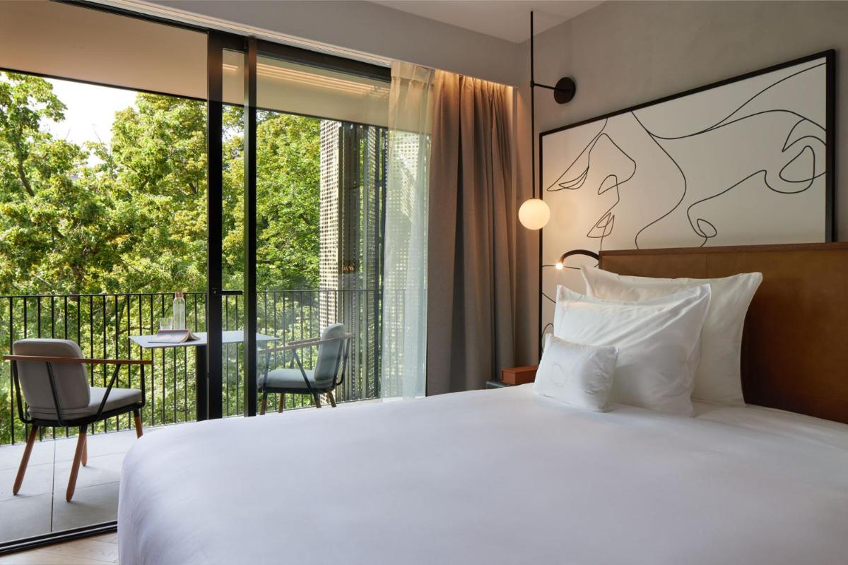 Un ou plusieurs lits dans un hébergement de l'établissement L'Esquisse Hotel & Spa Colmar - MGallery Collection