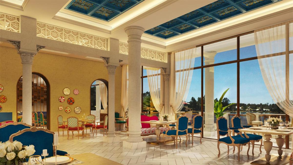 a rendering of a dining room with tables and chairs at Pilibhit House, Haridwar – IHCL SeleQtions in Haridwār