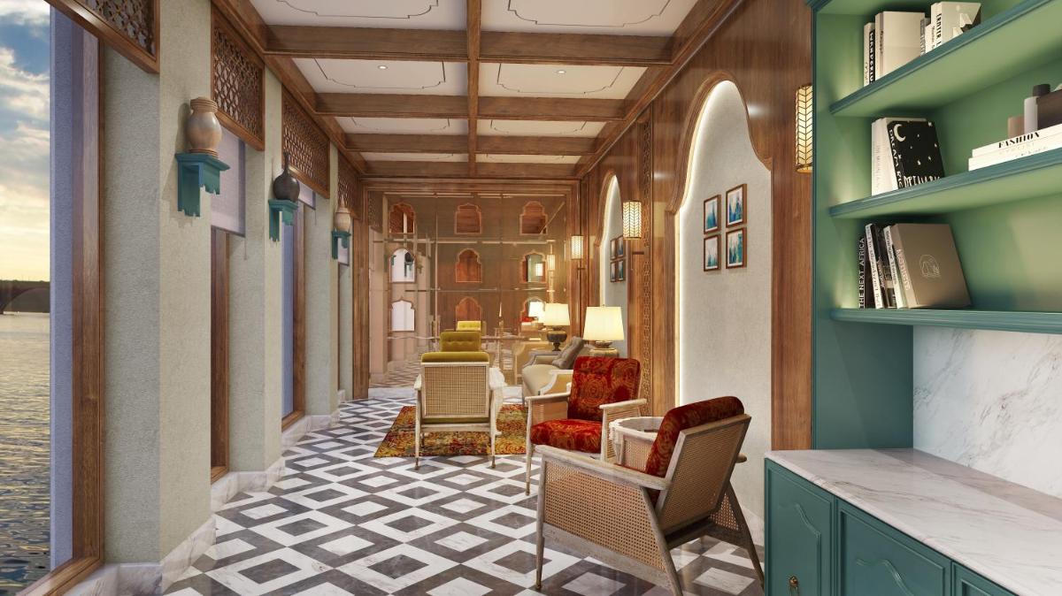 a corridor of a room with chairs and a table at Pilibhit House, Haridwar – IHCL SeleQtions in Haridwār
