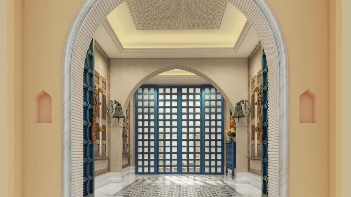 an archway in a building with a window at Pilibhit House, Haridwar – IHCL SeleQtions in Haridwār