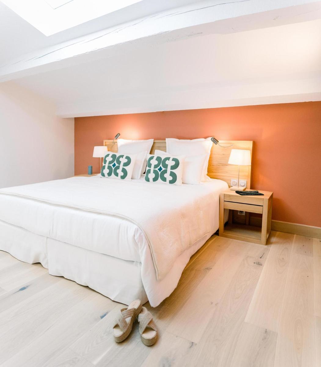 Un ou plusieurs lits dans un hébergement de l'établissement Château L'Hospitalet Wine Resort Beach & Spa