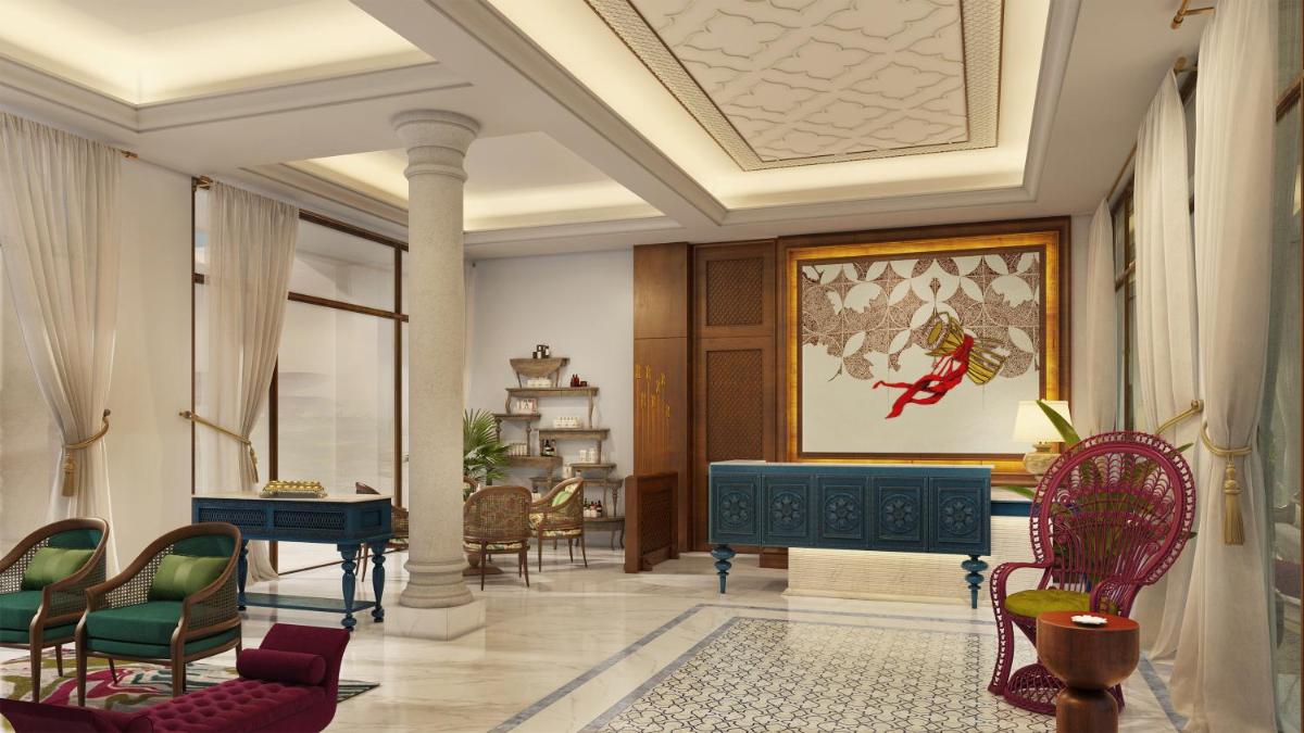 a lobby with chairs and a table in a room at Pilibhit House, Haridwar – IHCL SeleQtions in Haridwār
