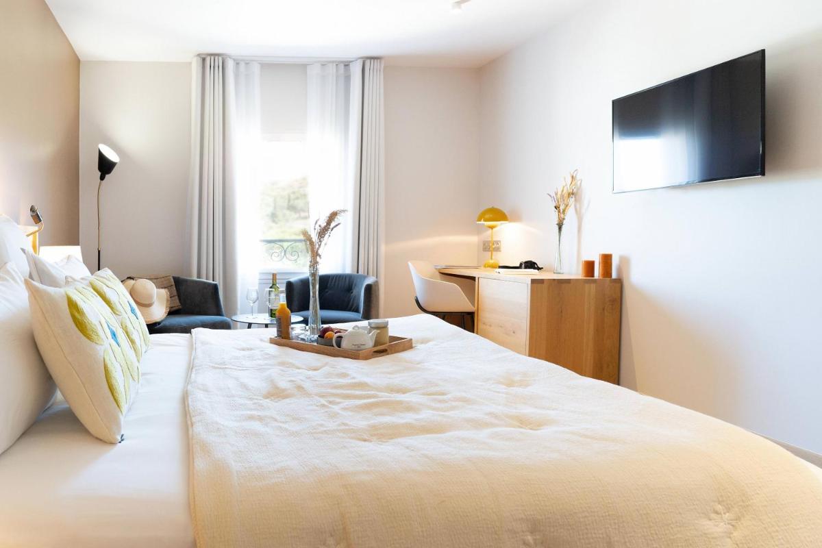 Un ou plusieurs lits dans un hébergement de l'établissement Château L'Hospitalet Wine Resort Beach & Spa