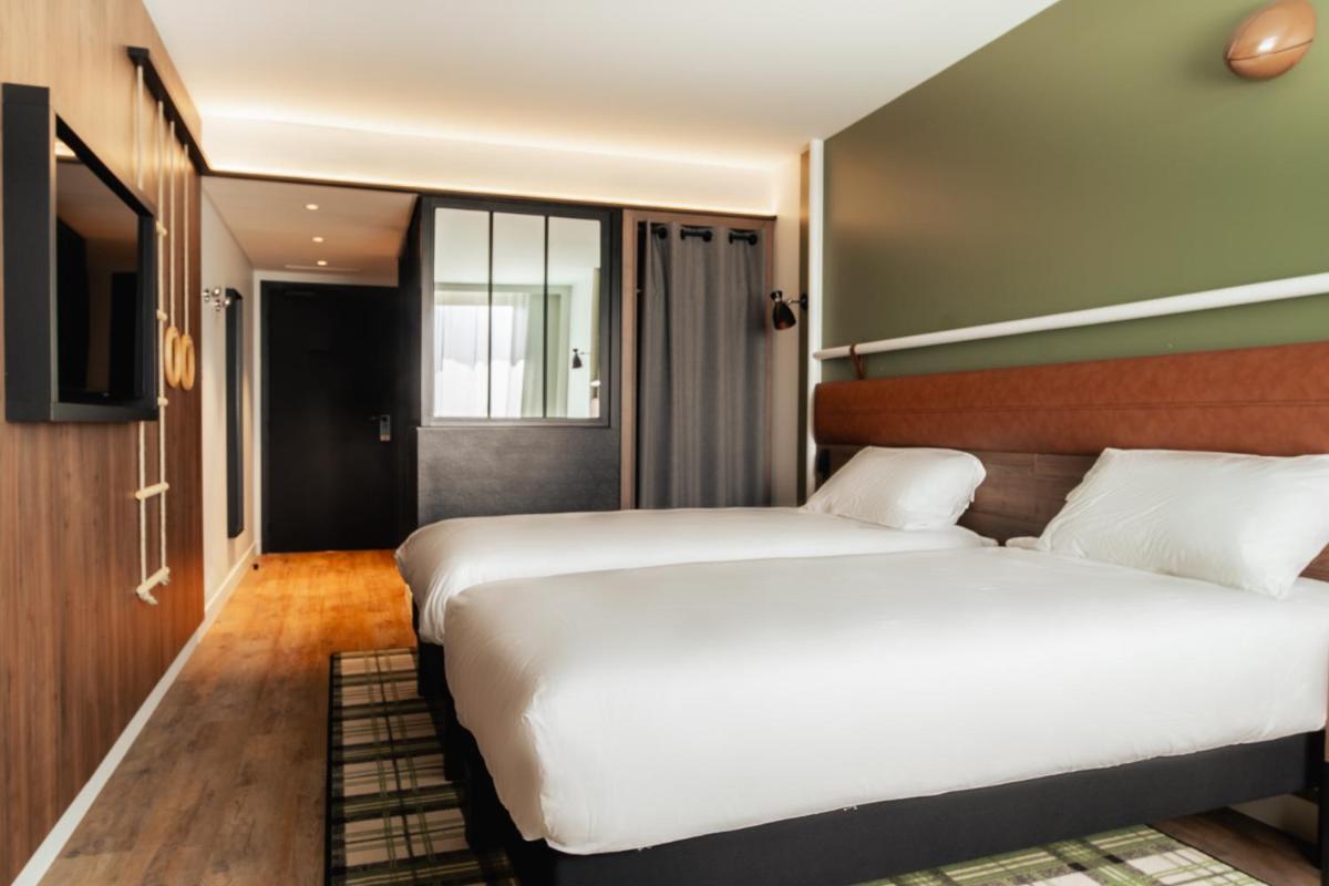 Un ou plusieurs lits dans un hébergement de l'établissement ibis Styles Castelnaudary