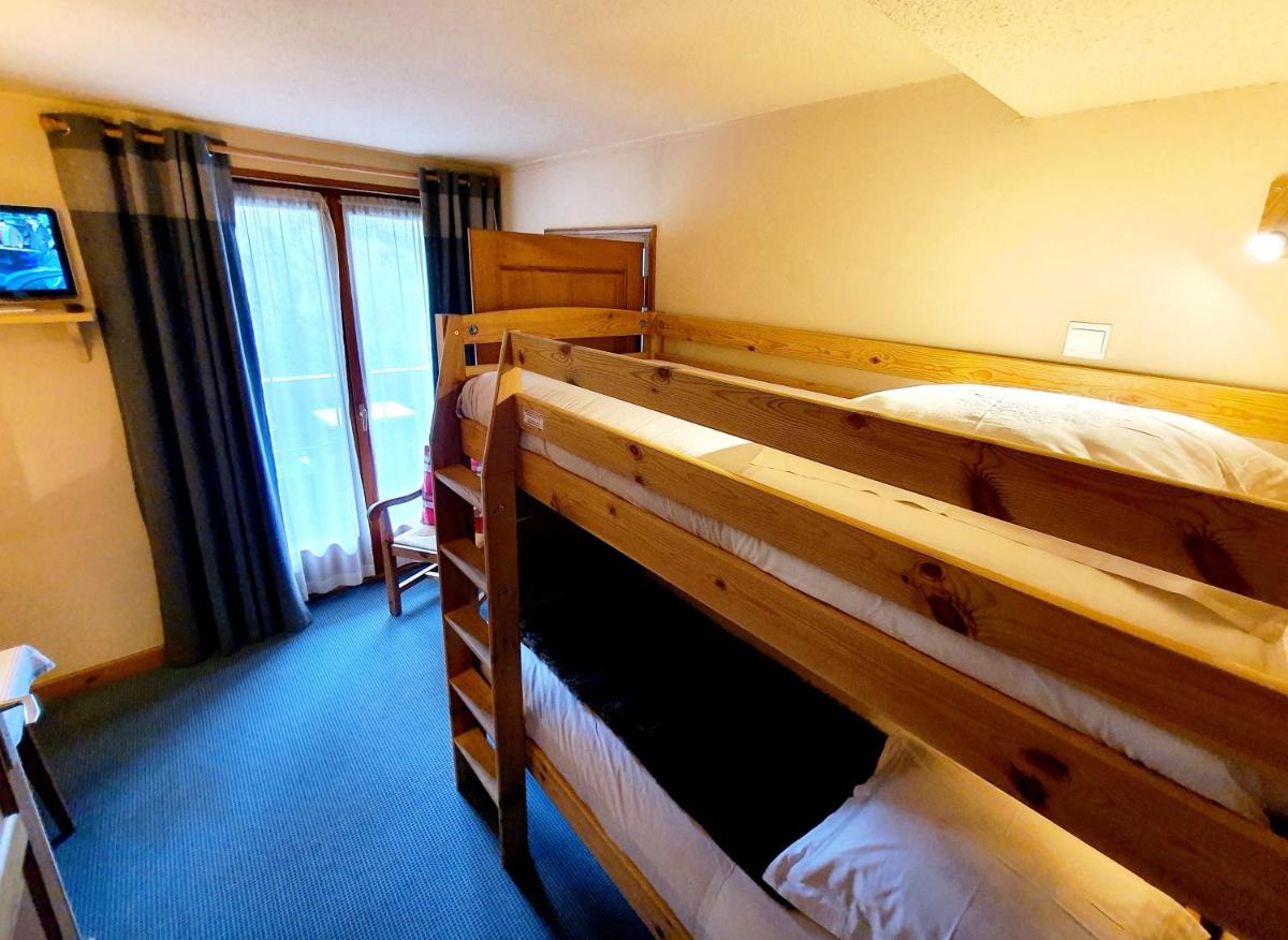 Un ou plusieurs lits dans un hébergement de l'établissement Café-Hôtel Le Morillon, Domaine du Grand Massif-Samoëns