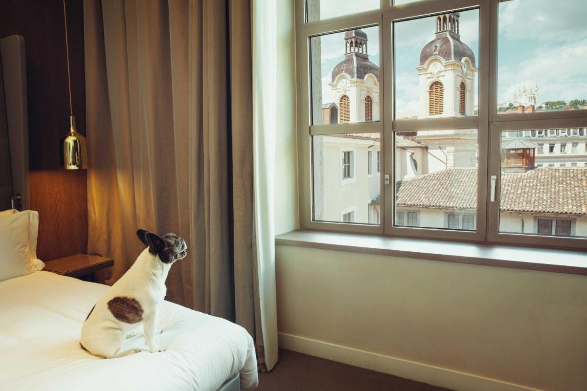 Un ou plusieurs lits dans un hébergement de l'établissement InterContinental Lyon - Hotel Dieu by IHG