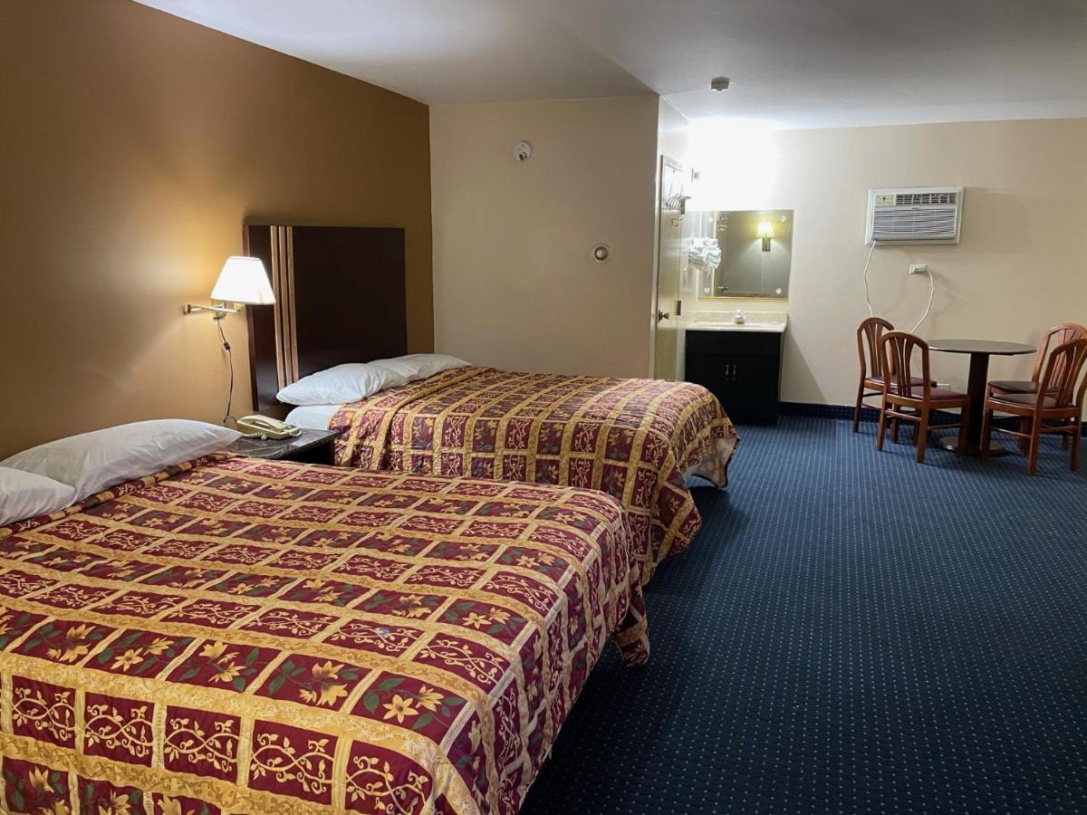 American Inn and Suites - Housity