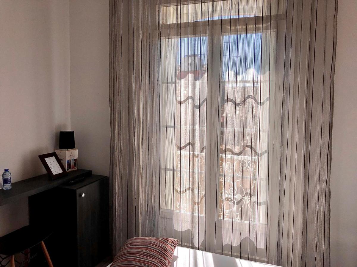 Un ou plusieurs lits dans un hébergement de l'établissement Hôtel Saint Louis