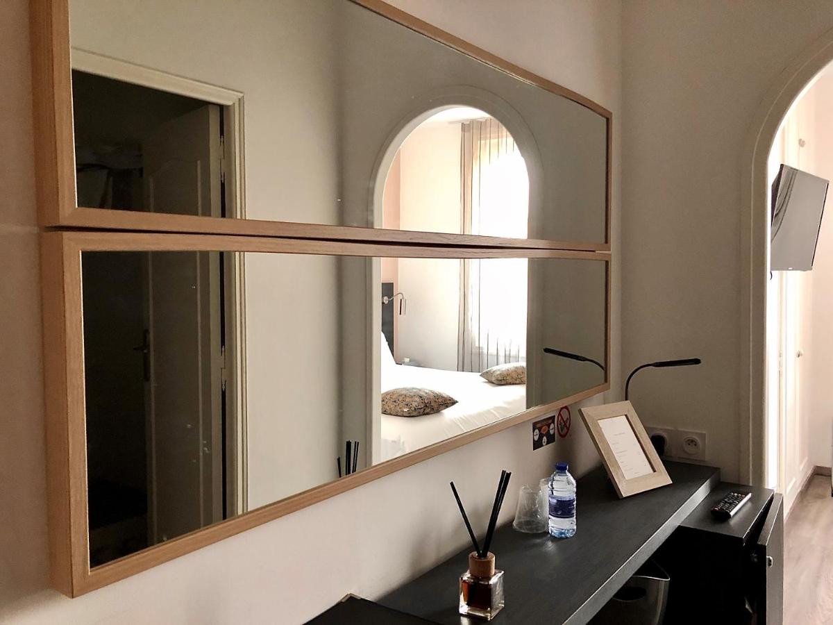 Un ou plusieurs lits dans un hébergement de l'établissement Hôtel Saint Louis