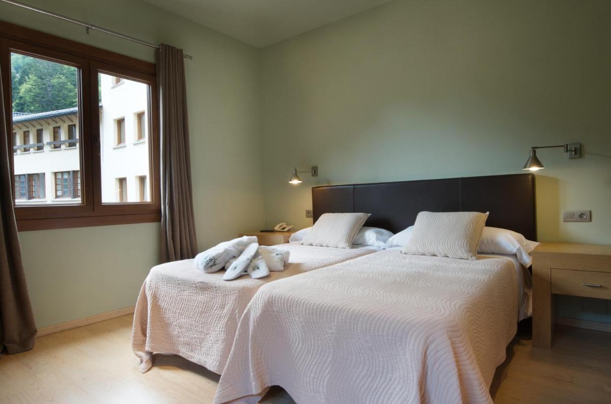 Cama o camas de una habitación en Hotel Manantial