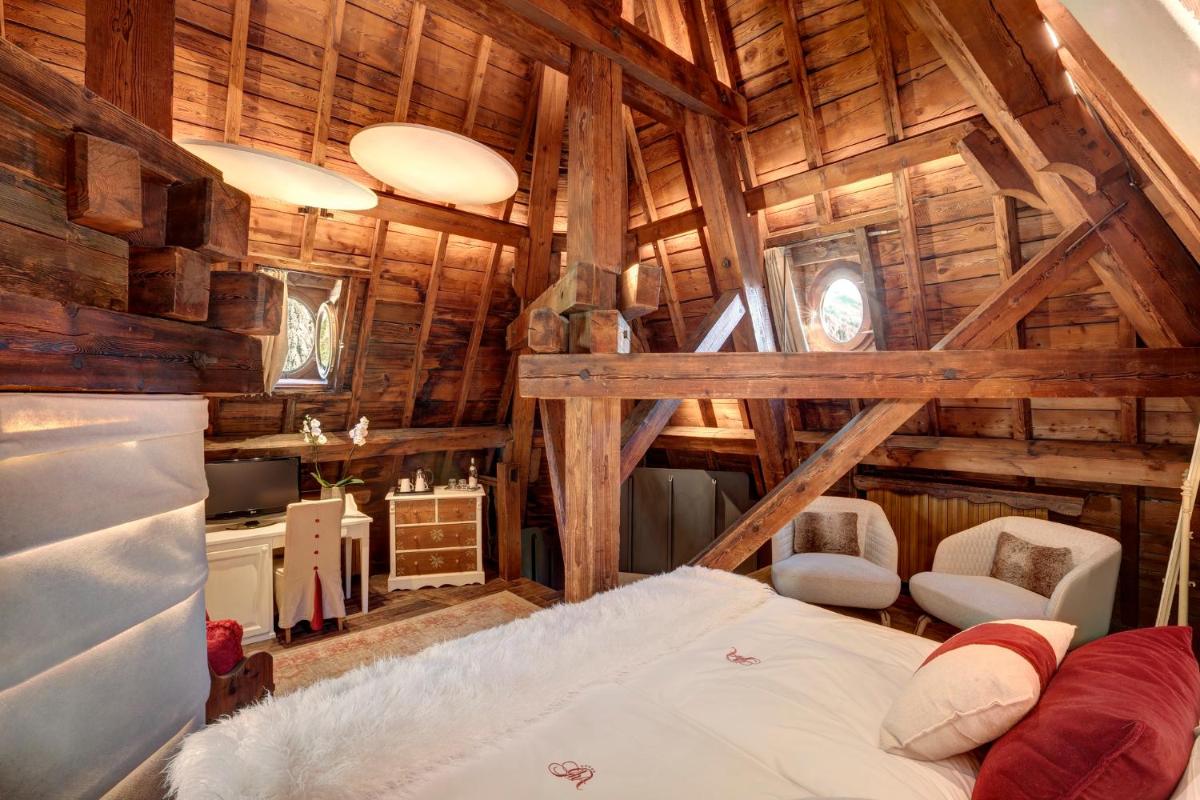 Un ou plusieurs lits dans un hébergement de l'établissement Grand Hôtel des Alpes