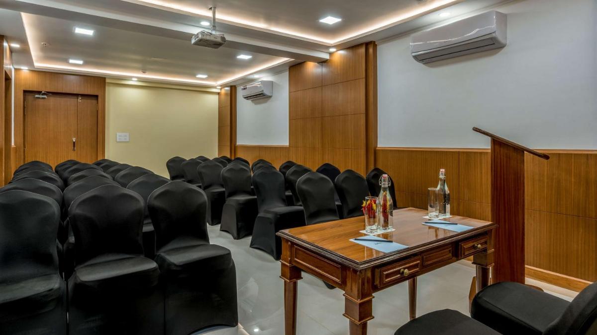a conference room with black chairs and a table at Radisson Goa Candolim in Candolim
