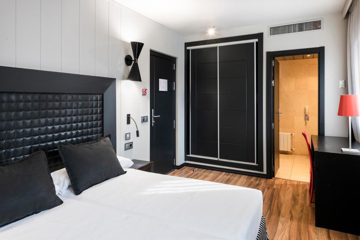 Cama o camas de una habitación en Salles Hotel Aeroport de Girona
