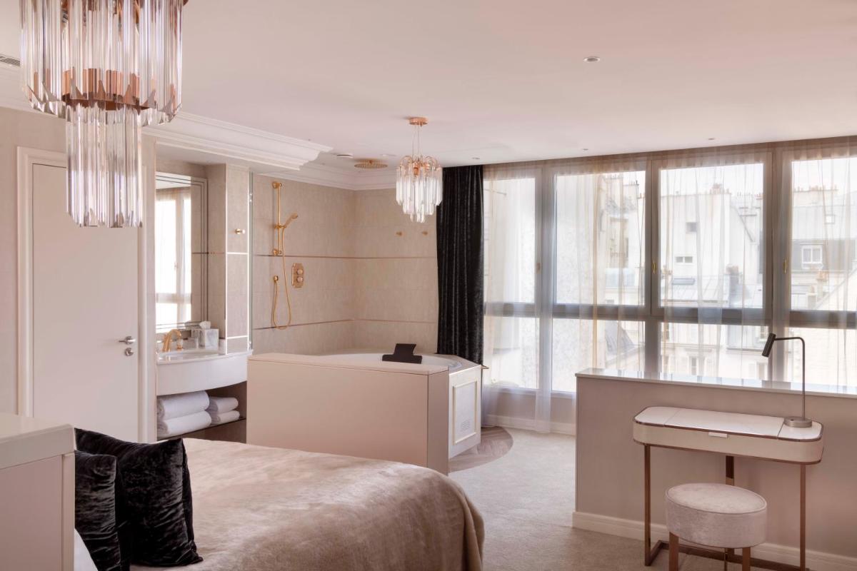 Un ou plusieurs lits dans un hébergement de l'établissement Paris j'Adore Hotel & Spa