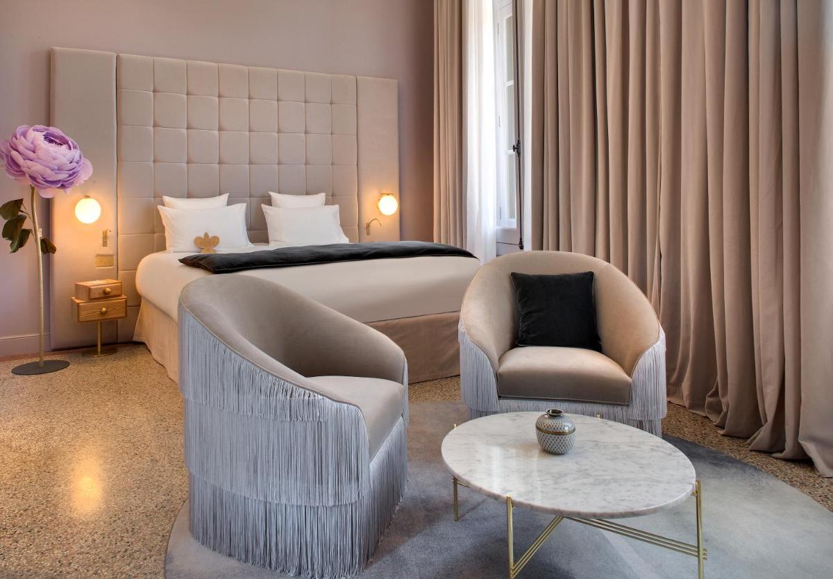 Un ou plusieurs lits dans un hébergement de l'établissement Hôtel Richer De Belleval - Relais & Châteaux