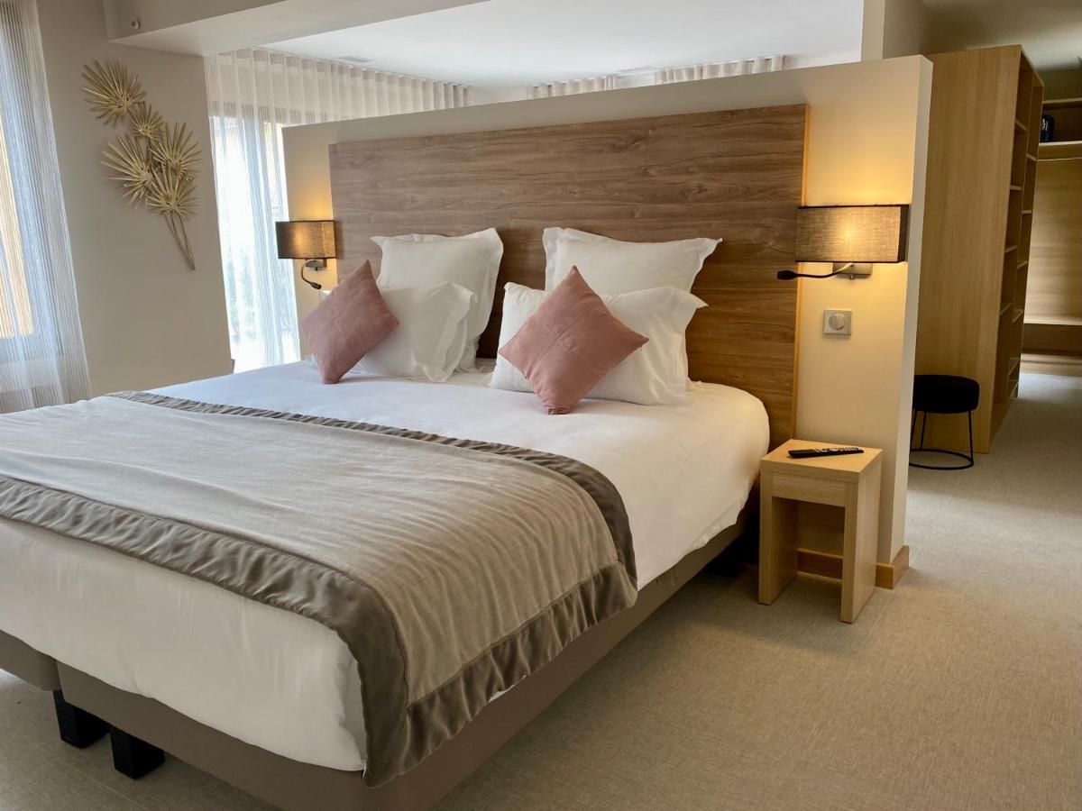 Un ou plusieurs lits dans un hébergement de l'établissement Ermitage de l'Oasis & Spa - Cannes Mandelieu