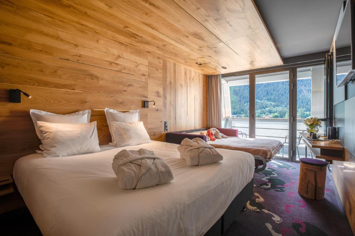 Un ou plusieurs lits dans un hébergement de l'établissement Alpina Eclectic Hotel