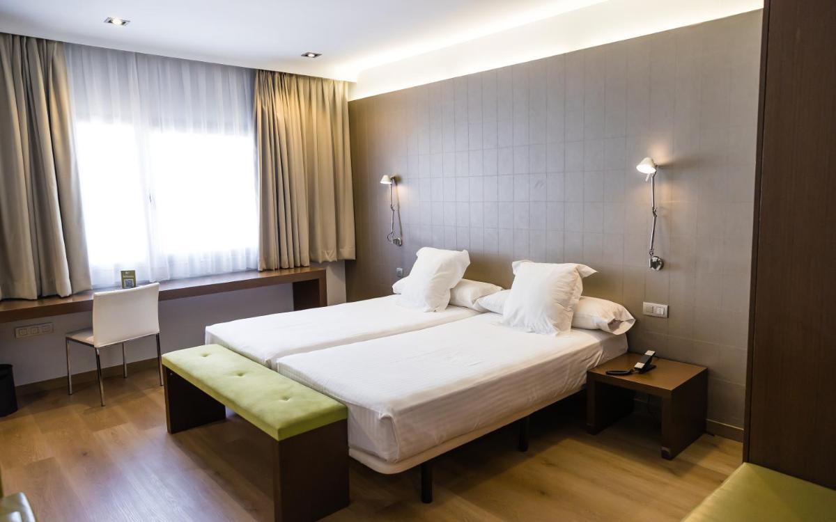 Cama o camas de una habitación en Hotel Veracruz Plaza & Spa