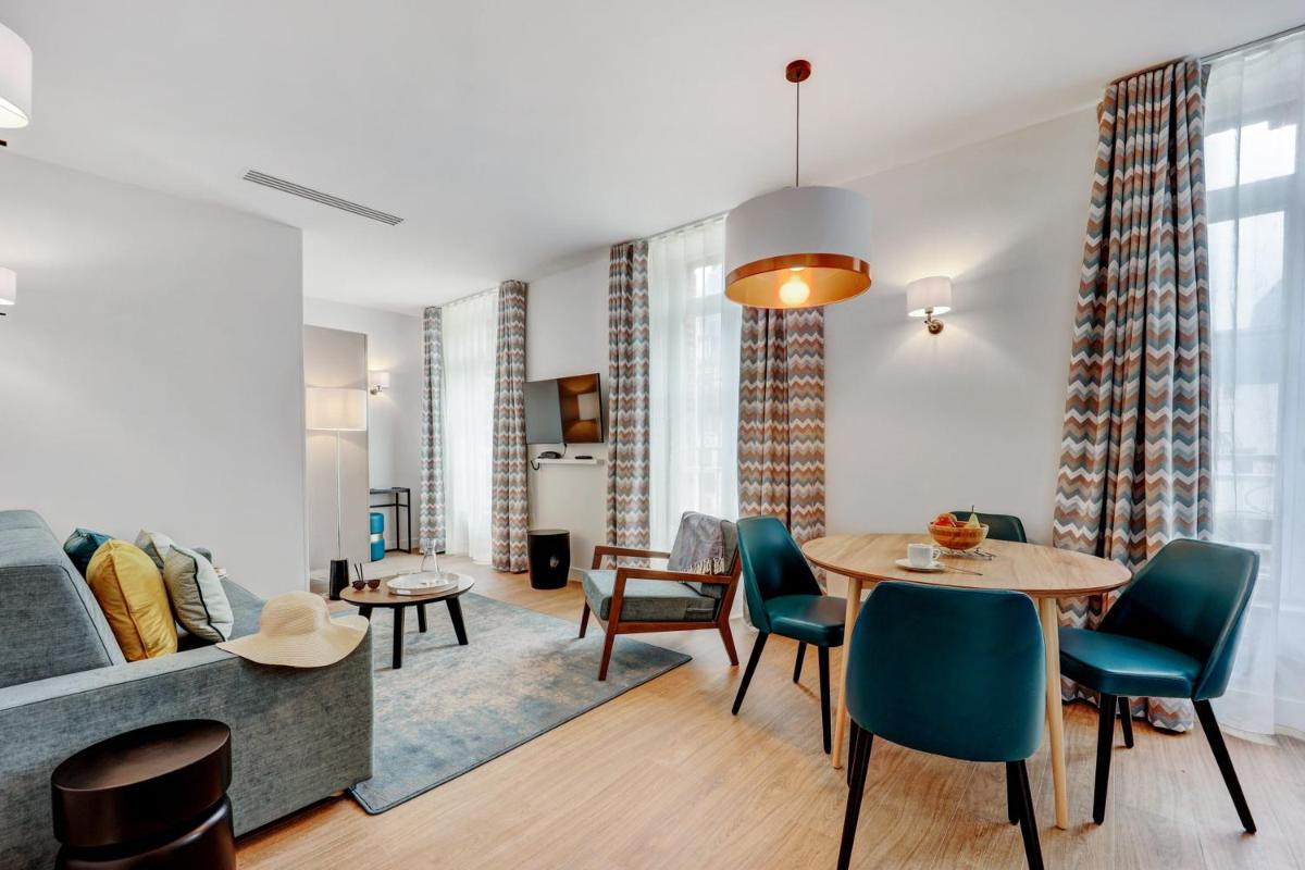 Coin salon dans l'établissement Résidence Pierre & Vacances Premium Presqu'Ile de la Touques