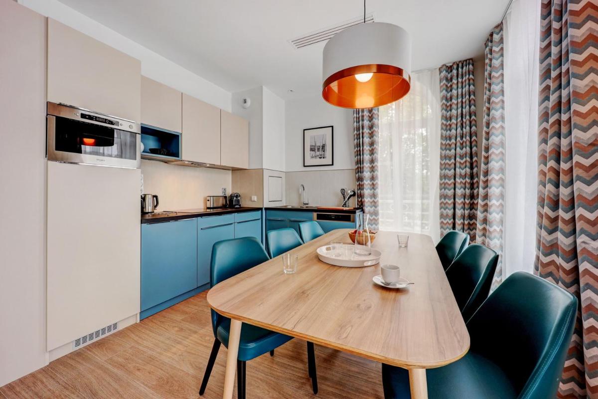 Cuisine ou kitchenette dans l'établissement Résidence Pierre & Vacances Premium Presqu'Ile de la Touques