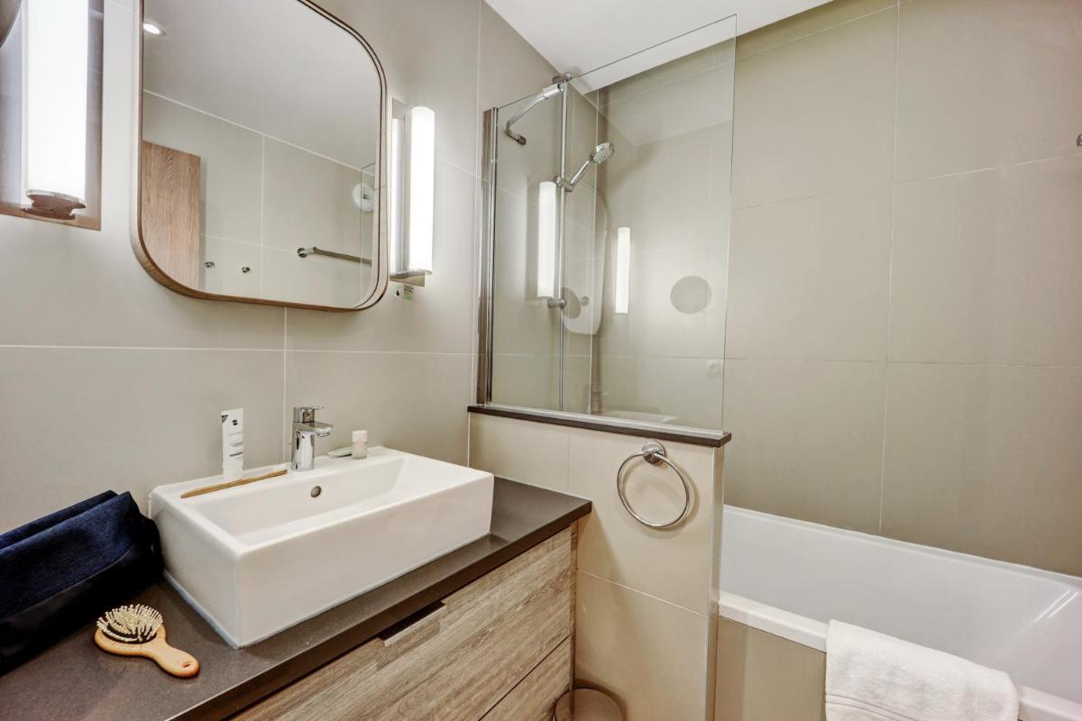 Salle de bains dans l'établissement Résidence Pierre & Vacances Premium Presqu'Ile de la Touques