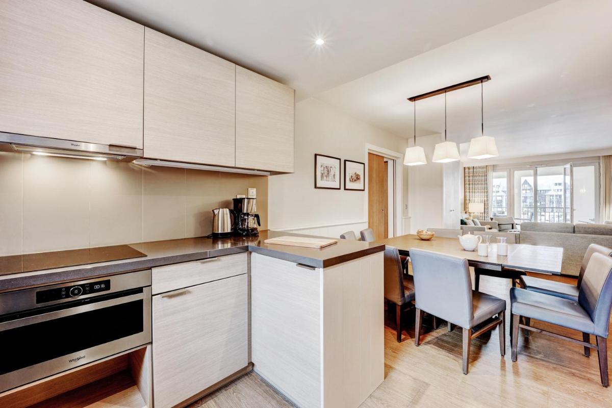 Cuisine ou kitchenette dans l'établissement Résidence Pierre & Vacances Premium Presqu'Ile de la Touques