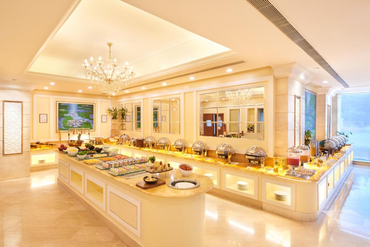a large room with a buffet of food at Accord Puducherry in Puducherry