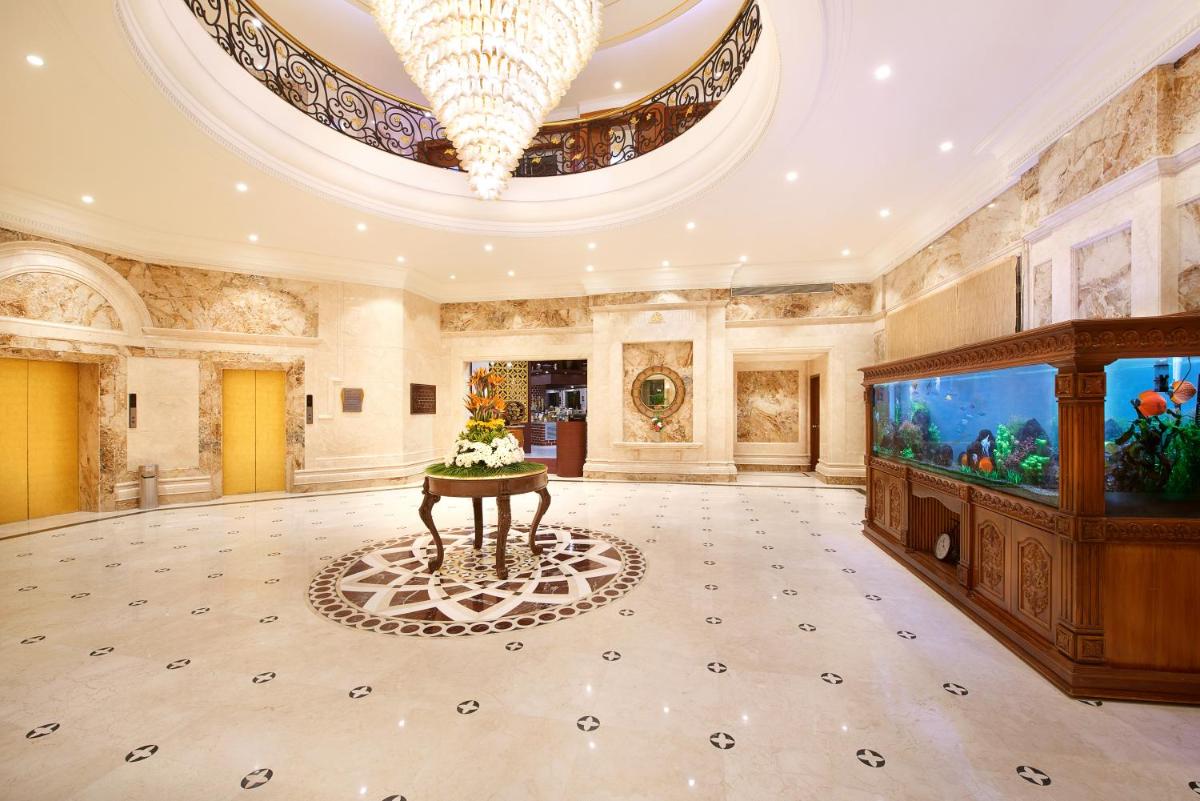 a large room with a large aquarium and a large ceiling at The Accord Metropolitan in Chennai