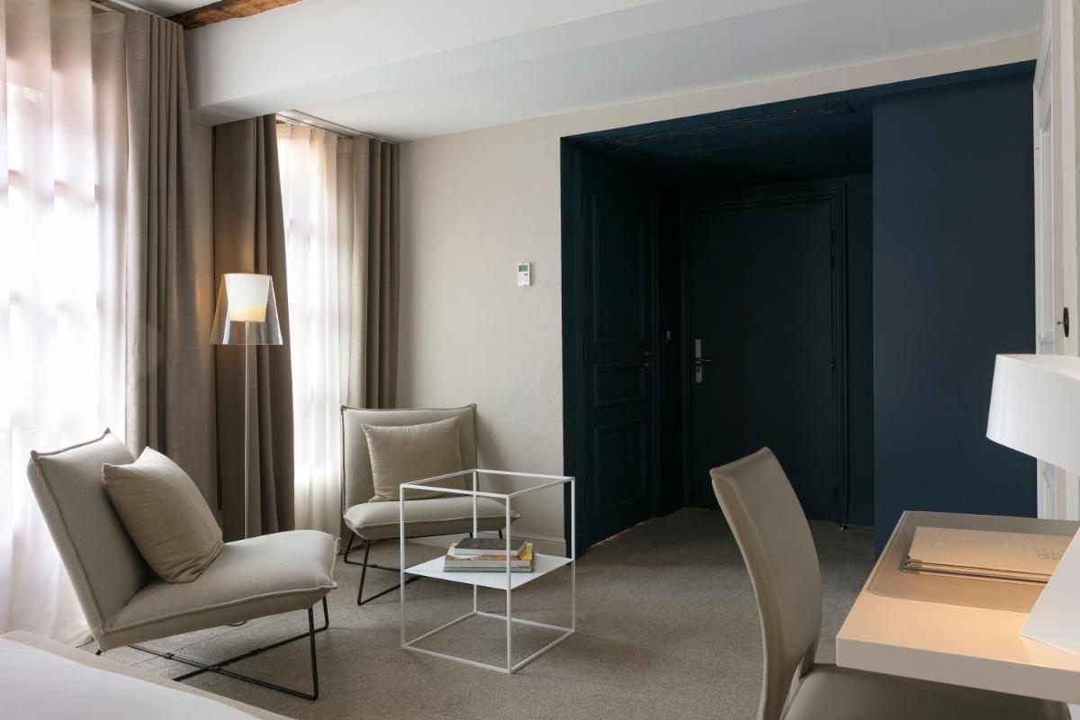 Coin salon dans l'établissement Relais & Châteaux La Maison Des Têtes