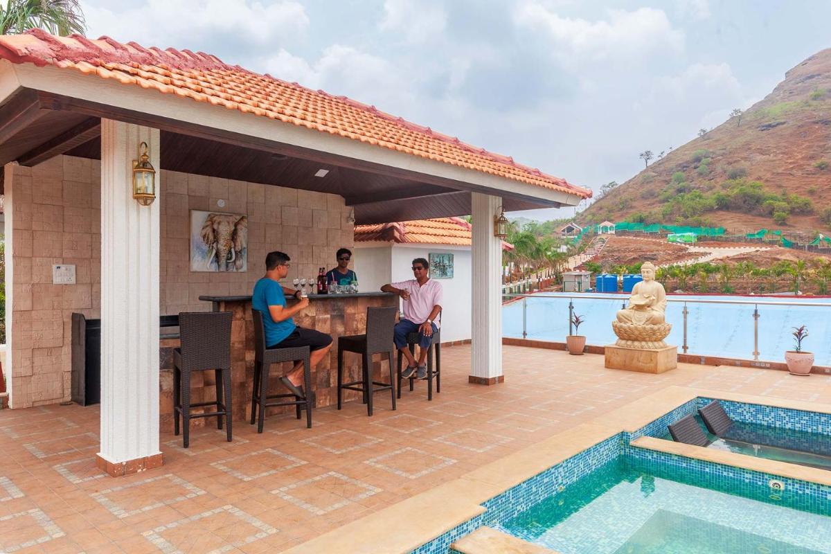 La Palm by StayVista - Mountain-view villa, boasting a spacious pool, Gym, Indoor games, Basketball court & A lush lawn with a gazebo - Housity