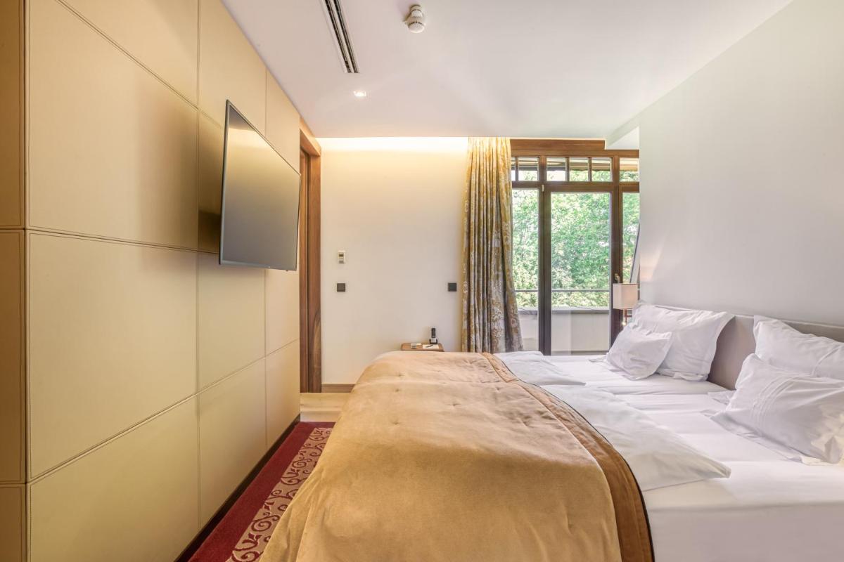 Ein Bett oder Betten in einem Zimmer der Unterkunft Wald & Schlosshotel Friedrichsruhe