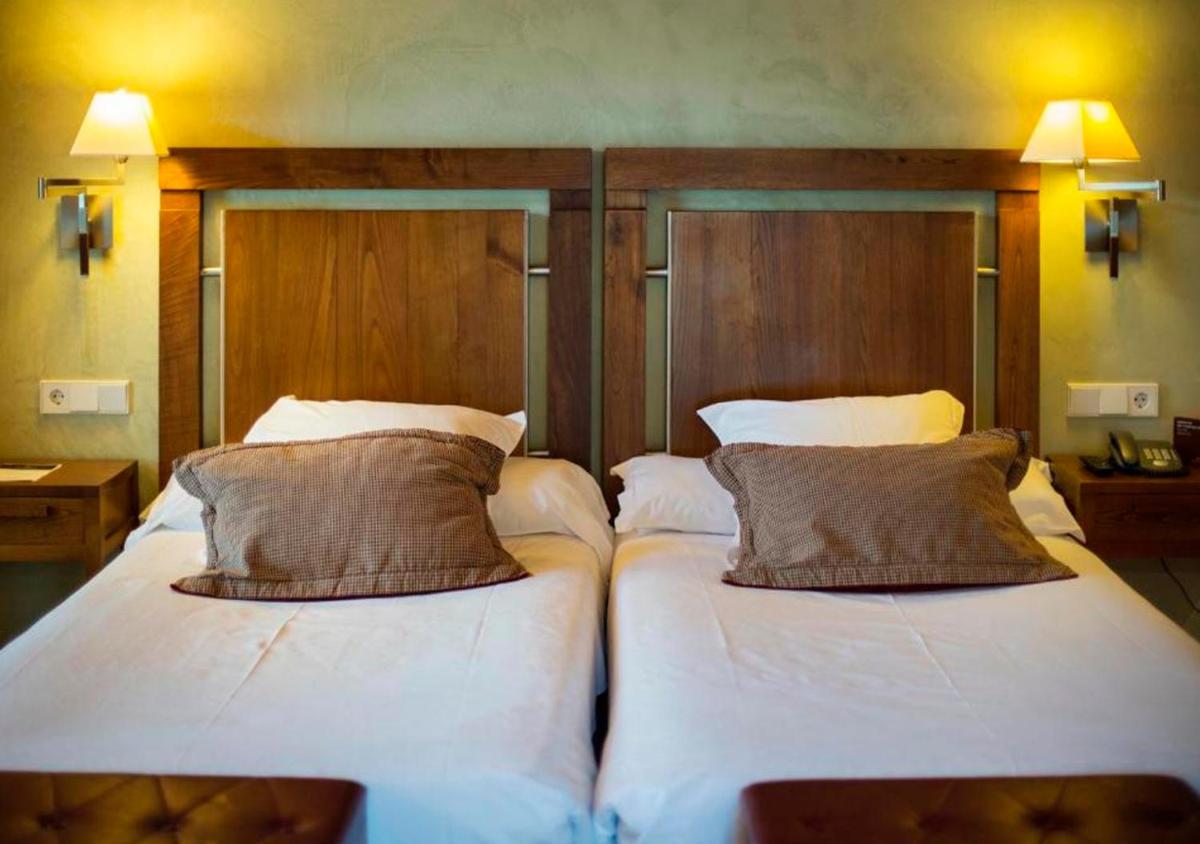 Cama o camas de una habitación en Parador de Santo Estevo