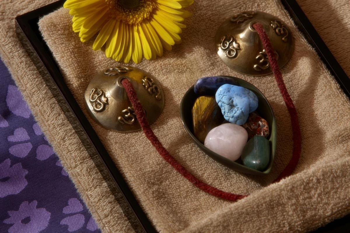 a group of beads in a heart shaped container with a flower at The Leela Mumbai in Mumbai a group of beads in a heart shaped container with a flower at The Leela Mumbai in Mumbai