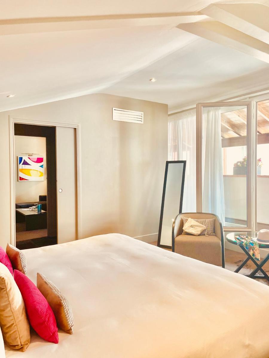 Un ou plusieurs lits dans un hébergement de l'établissement La Cour des Consuls Hotel & Spa Toulouse - MGallery Collection