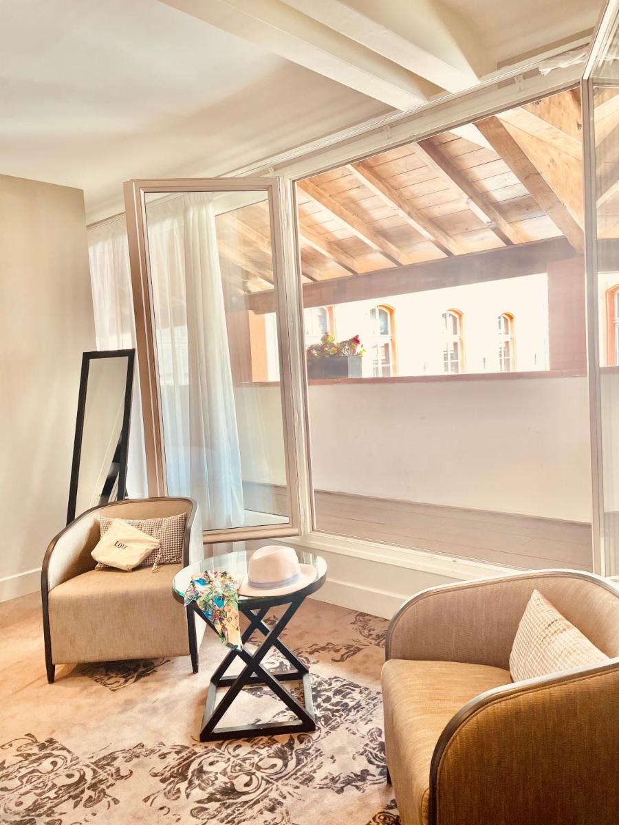 Coin salon dans l'établissement La Cour des Consuls Hotel & Spa Toulouse - MGallery Collection