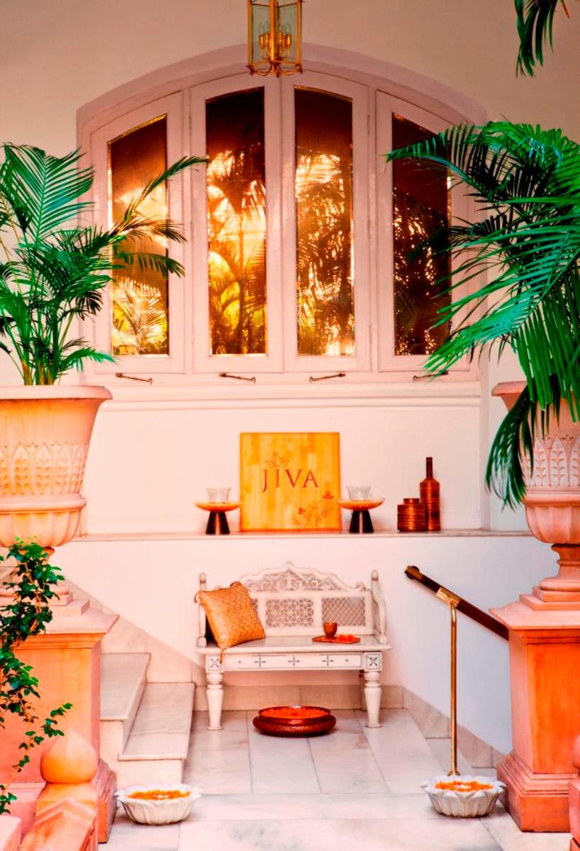 a white bench in a room with windows at The Taj Mahal Tower, Mumbai in Mumbai a white bench in a room with windows at The Taj Mahal Tower, Mumbai in Mumbai